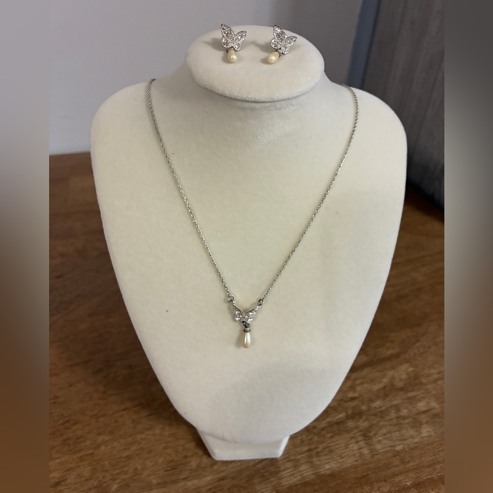 Silver toned necklace and earring set &butterfly pendant withdangling faux pearl